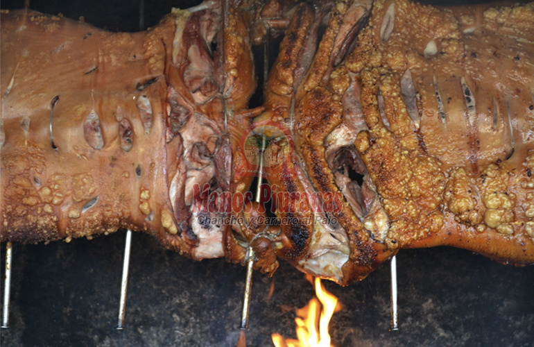 chancho y carnero al palo